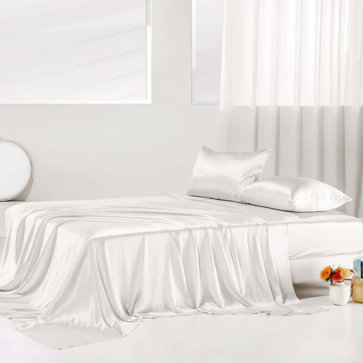 Promeed white silk bedding arranged on a bed in a sunlit bedroom