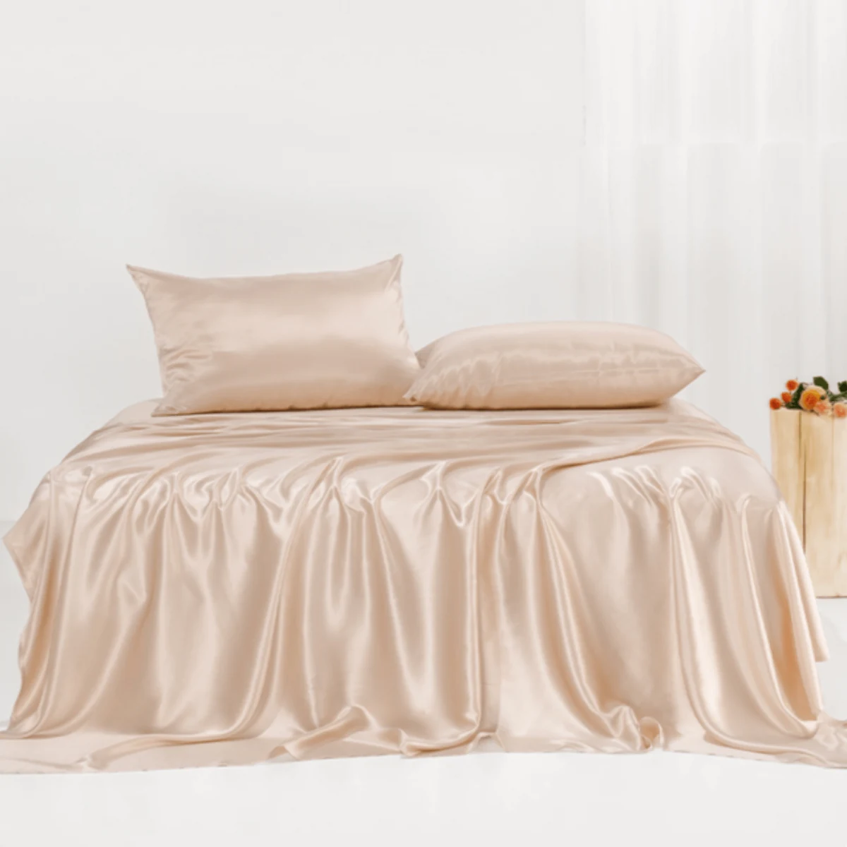 Promeed champagne silk bedding arranged on a bed